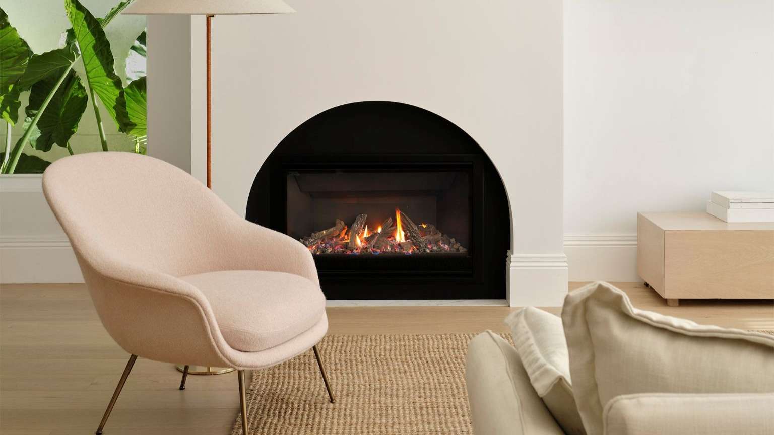 Escea DF960 gas fireplace featured in custom curved surround.