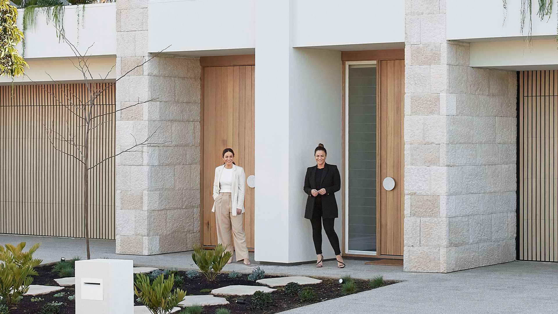 Design duo twin sisters, Alisa & Lysandra, at their side by side homes
