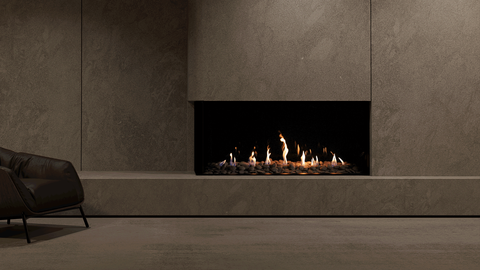 Minimalist interior with a corner gas fireplace built into a textured concrete wall, featuring a linear flame bed with river stones and a dark leather armchair in the foreground.
