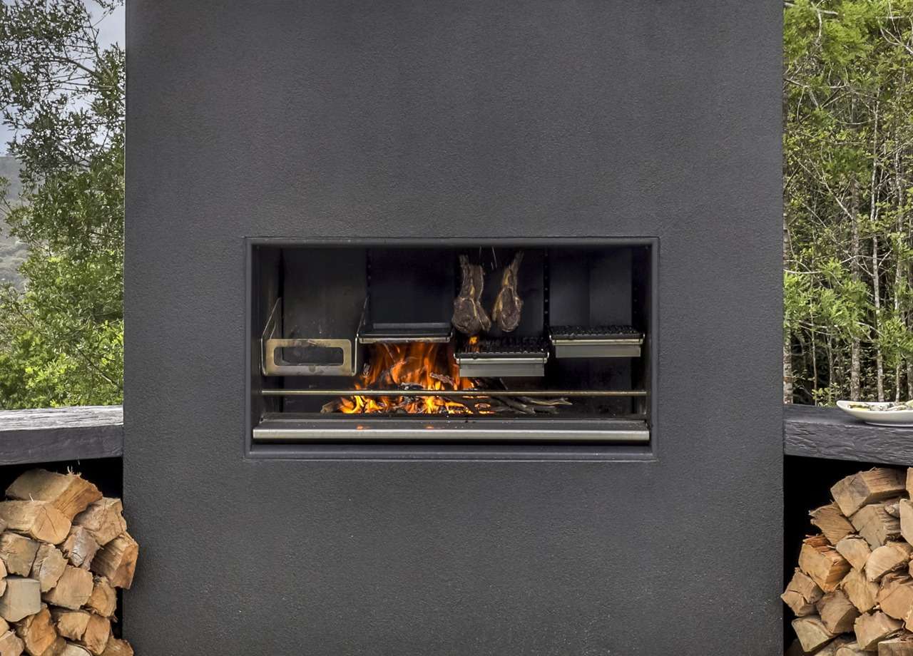 An outdoor kitchen with a million-dollar view – Waimauku by Love Kitchens